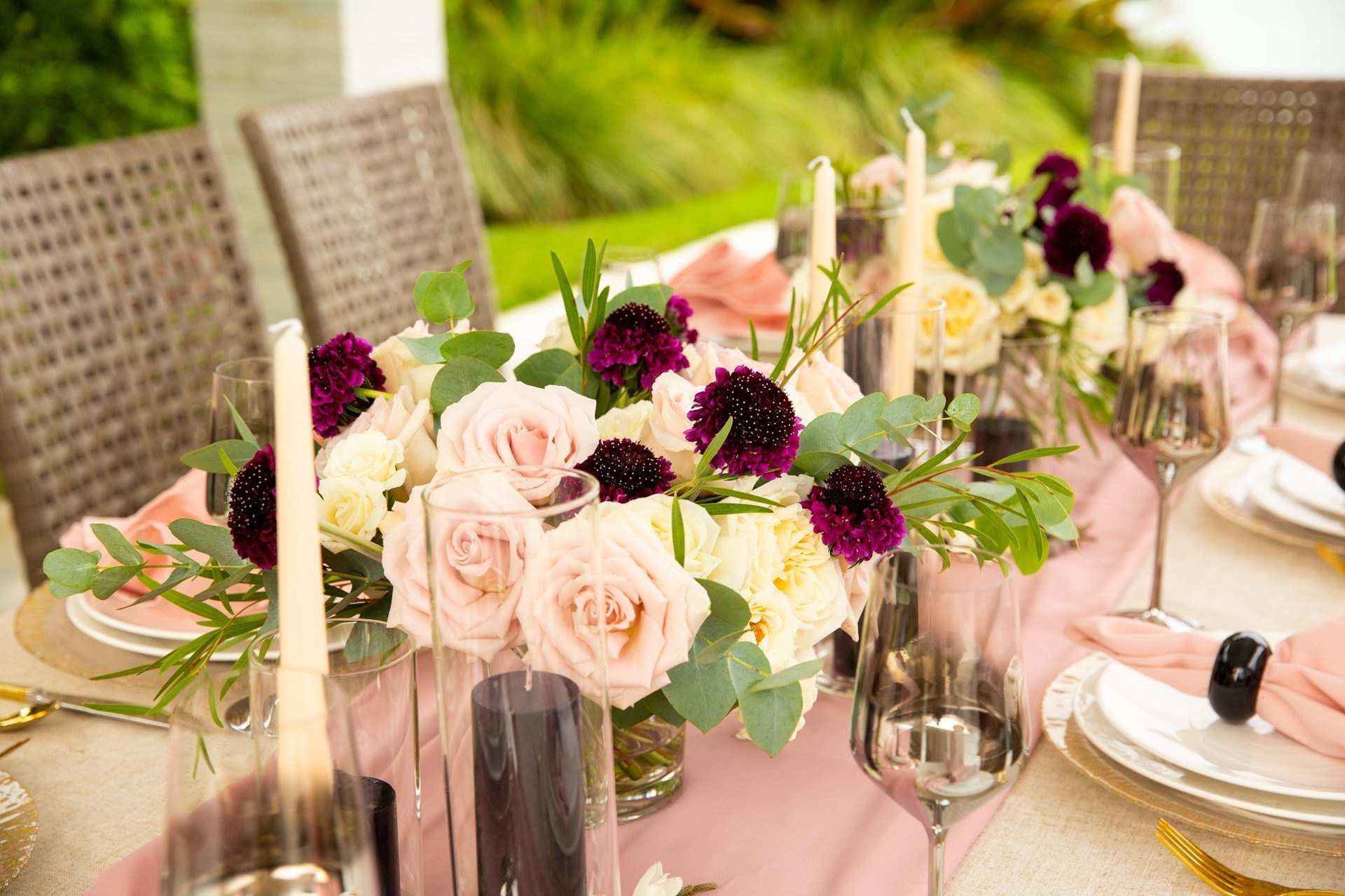 Table with blush and burgundy flowers