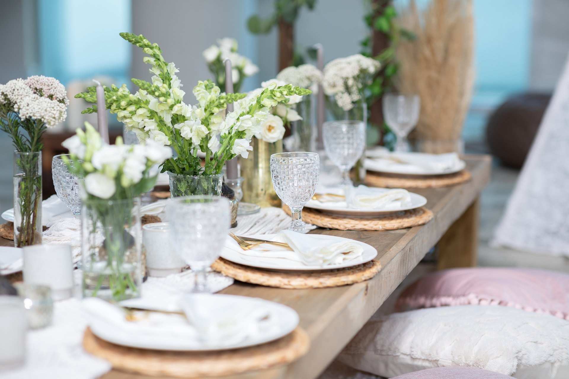 Table set with glassware, flowers and candles