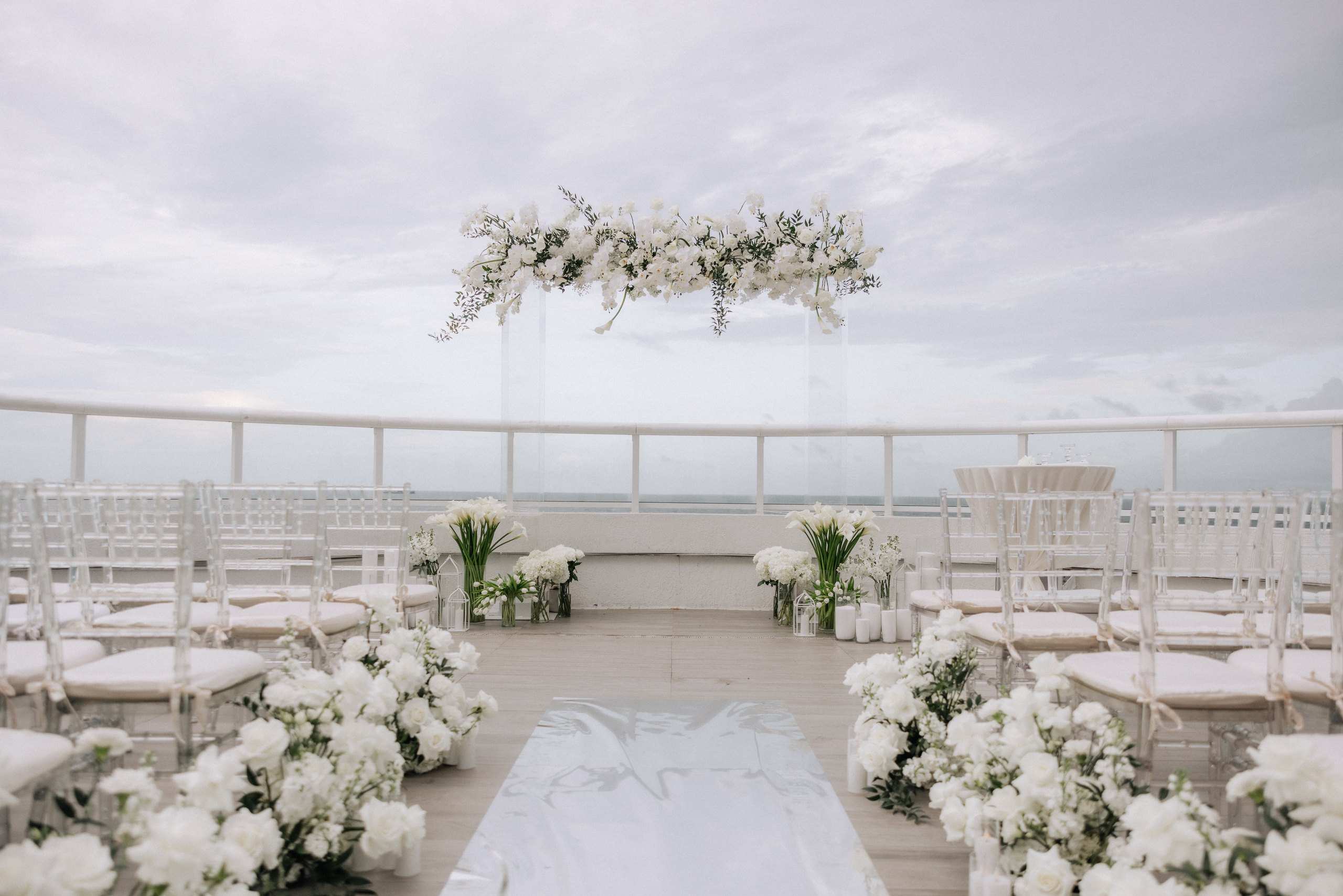 White ceremony setup on a rooftop