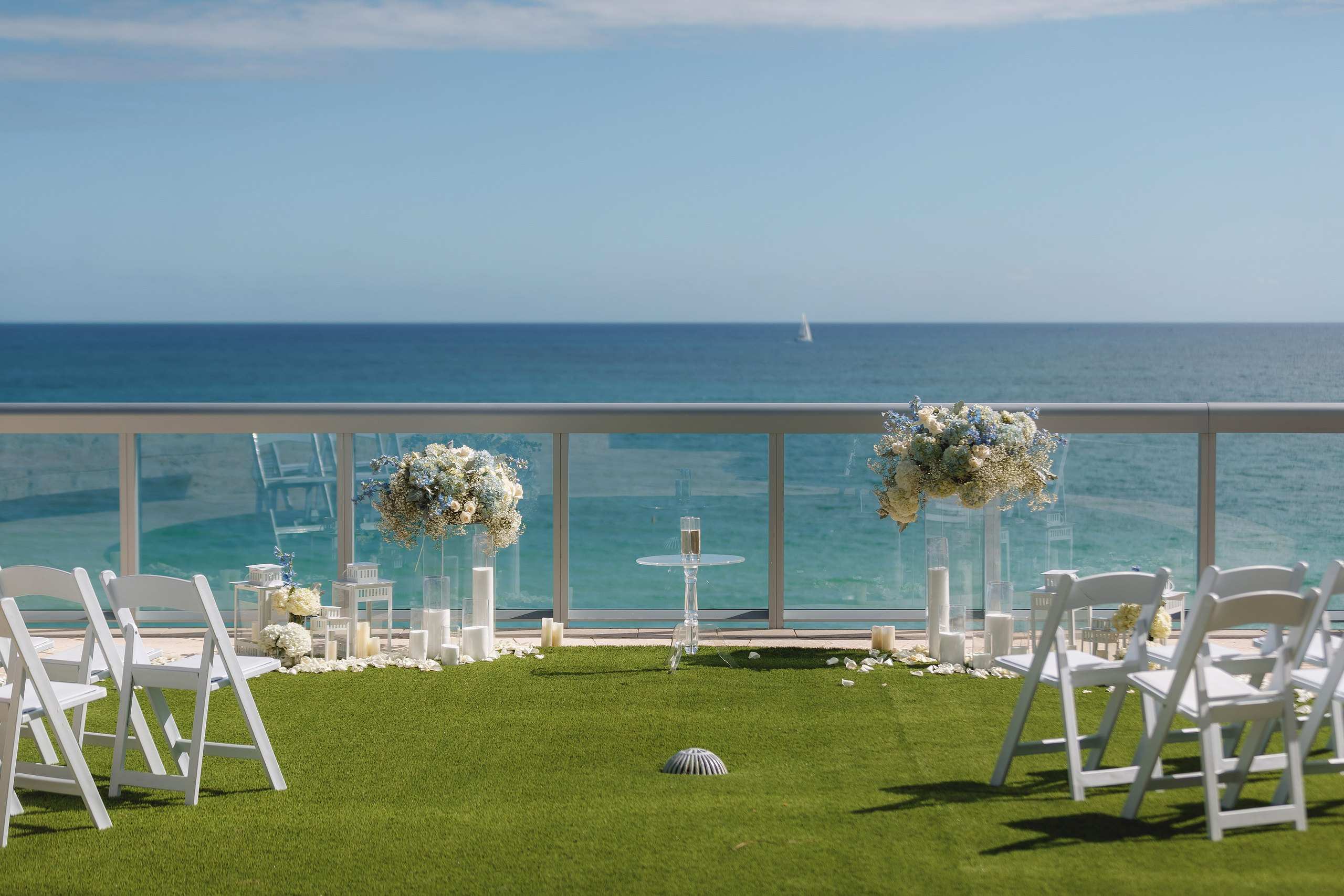 Rooftop ceremony chairs facing the ocean