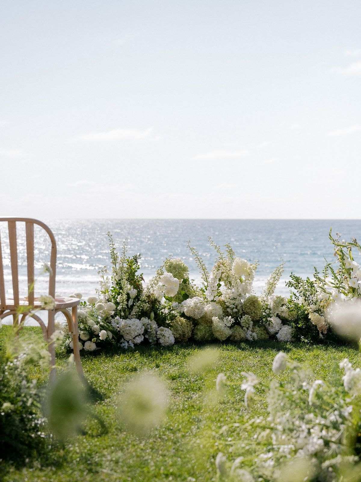 Garden style semi circle of flowers and greenery