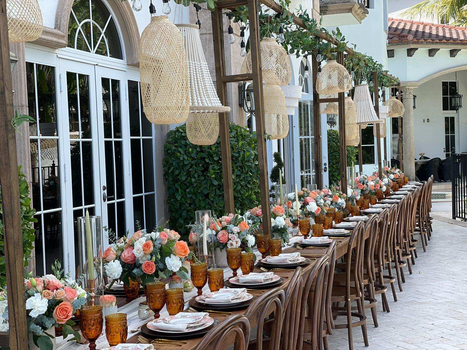 Long reception table in a courtyard