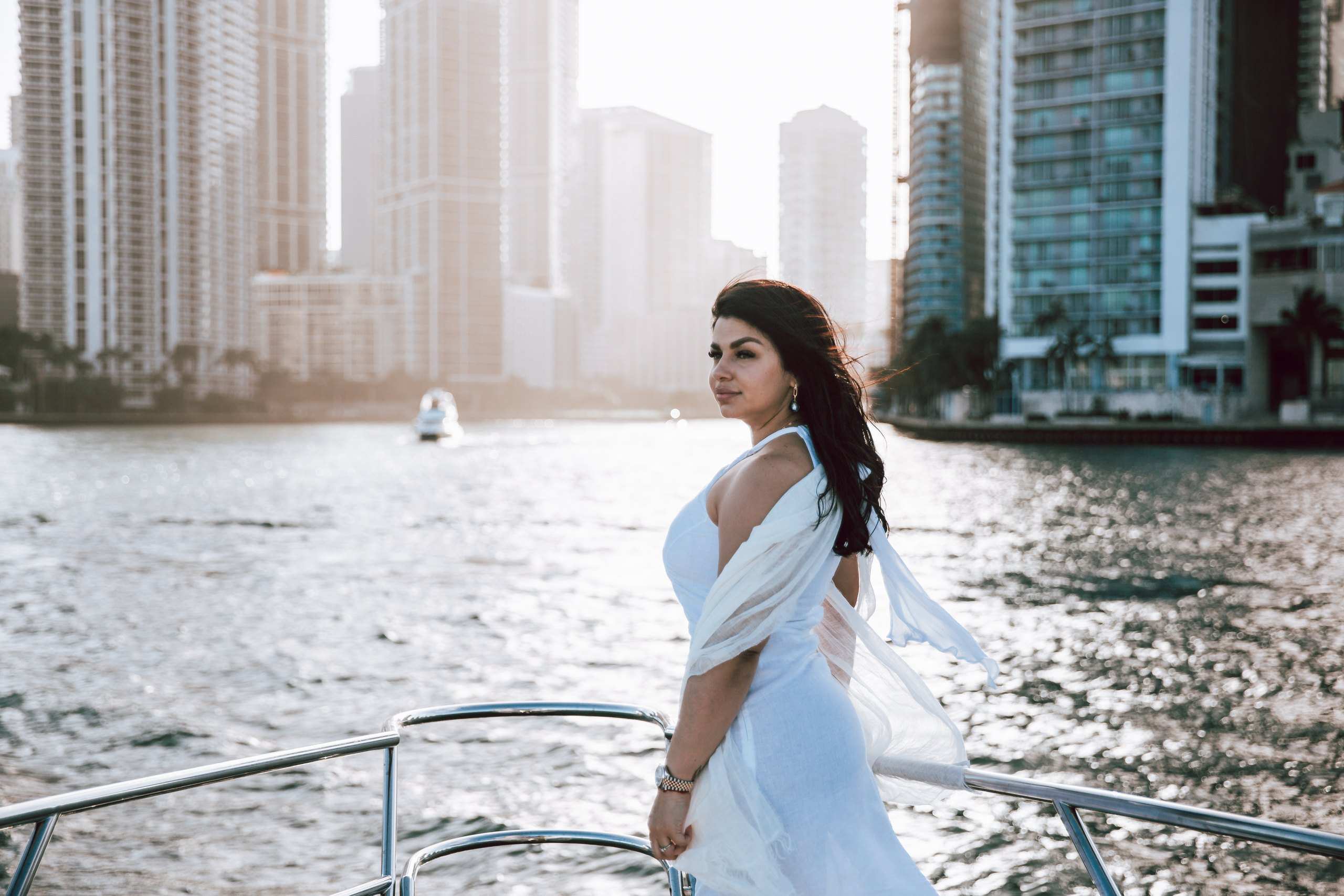 Bride on a yacht with the Miami skyline behind her